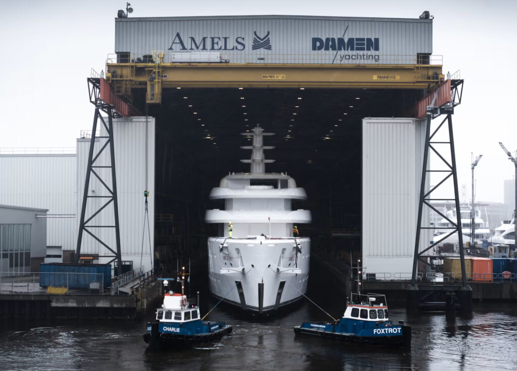 The first Amels 80, a groundbreaking 80-metre yacht, arrives in the Netherlands. Designed by Espen Øino, it combines luxury with innovative sustainability, ready for 2025.