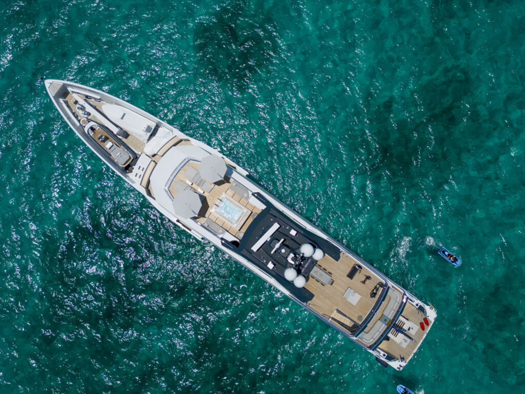 ENTOURAGE, a 60-meter superyacht by Amels, blends sleek design by Espen Øino and Burdifilek's serene interiors with advanced hybrid technology, offering luxurious, eco-friendly cruising experiences.