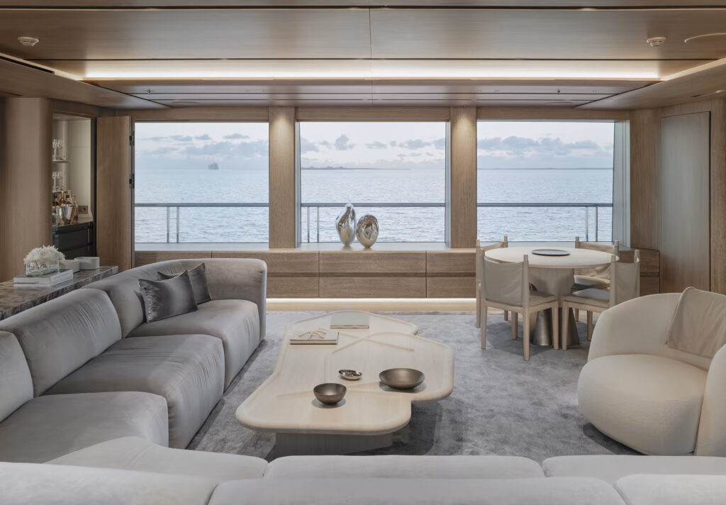 ENTOURAGE, a 60-meter superyacht by Amels, blends sleek design by Espen Øino and Burdifilek's serene interiors with advanced hybrid technology, offering luxurious, eco-friendly cruising experiences.