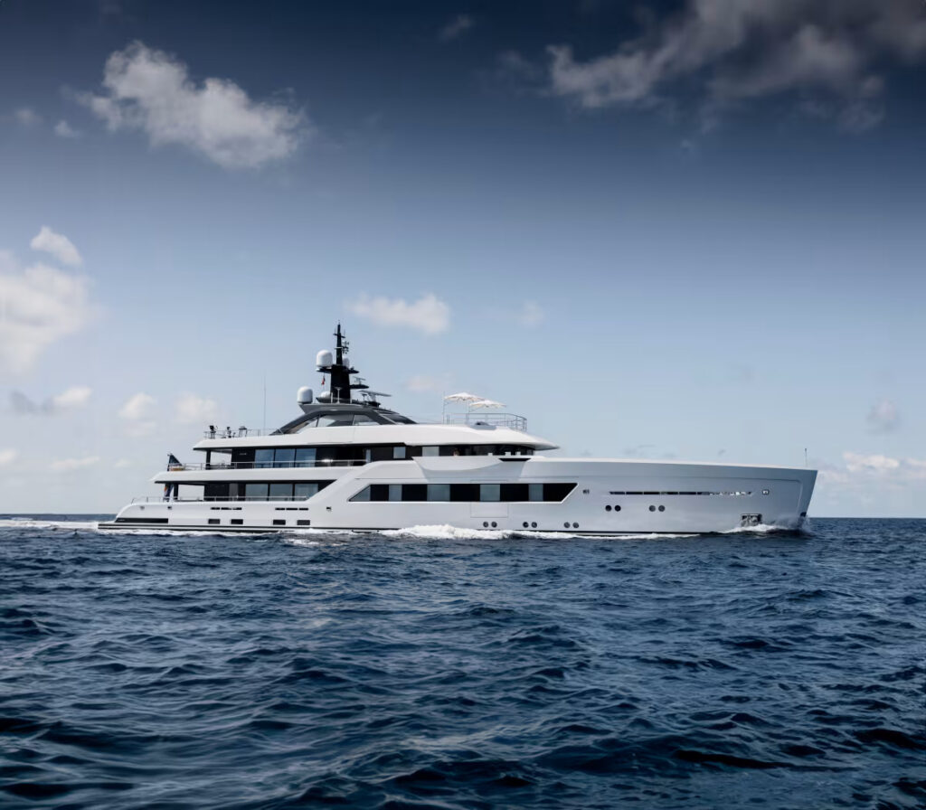 ENTOURAGE, a 60-meter superyacht by Amels, blends sleek design by Espen Øino and Burdifilek's serene interiors with advanced hybrid technology, offering luxurious, eco-friendly cruising experiences.