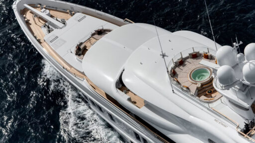 SYNTHESIS, a 74-metre Amels superyacht, blends performance and luxury with custom designs, featuring a dedicated Owner's Deck, foredeck jacuzzi, and seamless indoor-outdoor spaces.