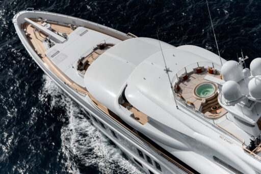 SYNTHESIS, a 74-metre Amels superyacht, blends performance and luxury with custom designs, featuring a dedicated Owner's Deck, foredeck jacuzzi, and seamless indoor-outdoor spaces.