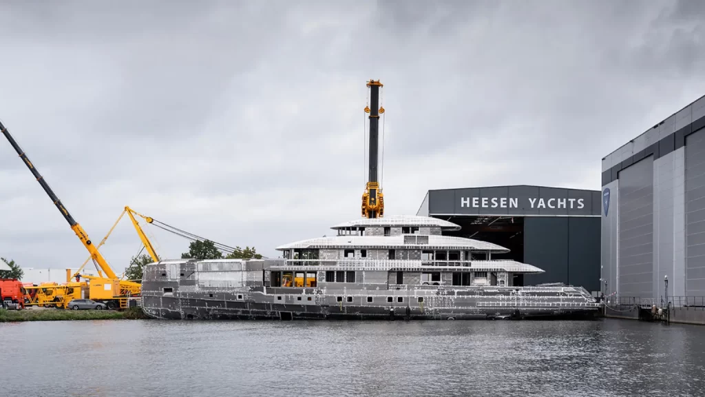 Heesen Yachts reaches a major milestone with the hull and superstructure joining of the custom 57m Project Setteesettanta, set for delivery in 2026, featuring luxury and cutting-edge design.