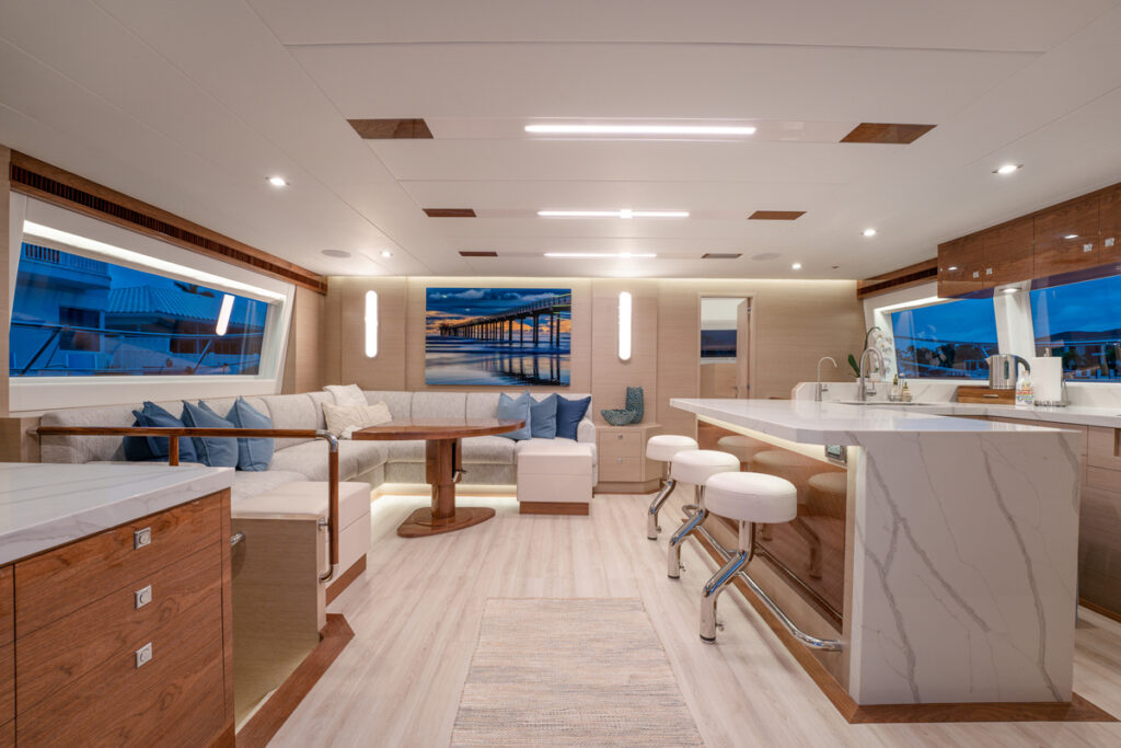 Dr. Wayne Andersen’s Horizon PC60 *Synergy* combines luxury and off-grid efficiency, featuring solar power for remote cruising while providing quiet spaces for work and family adventures.