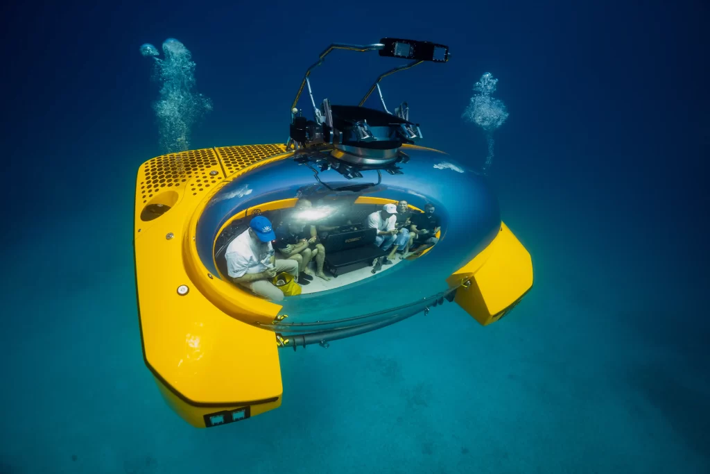 A luxury UFO-like submarine takes passengers 200m deep for fine dining, spa treatments, and even weddings, offering a futuristic underwater adventure.