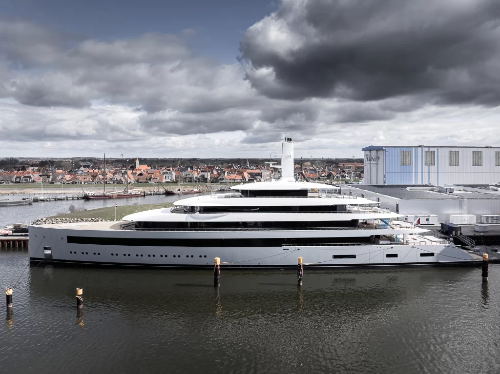 Feadship's new £170 million superyacht, Moonrise, is designed for near silence at sea, featuring luxury amenities like a gym, cinema, and a sleek, antenna-free design.